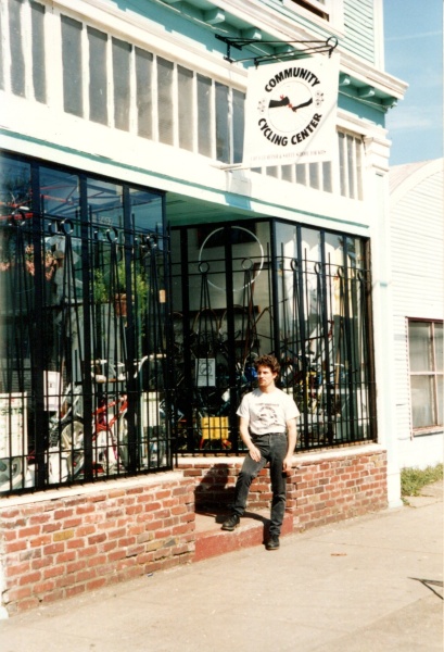 Founder Brian Lacy with original logo and bike shop location on 24th and Alberta
