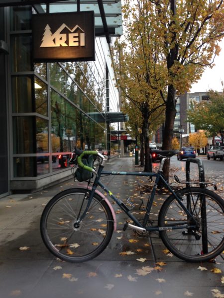 Bike in front of REI sign