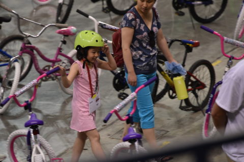 Child looking for her bike